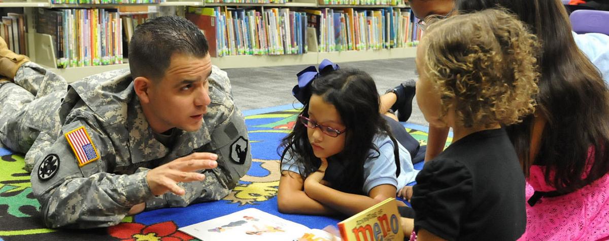 soldier reading to children